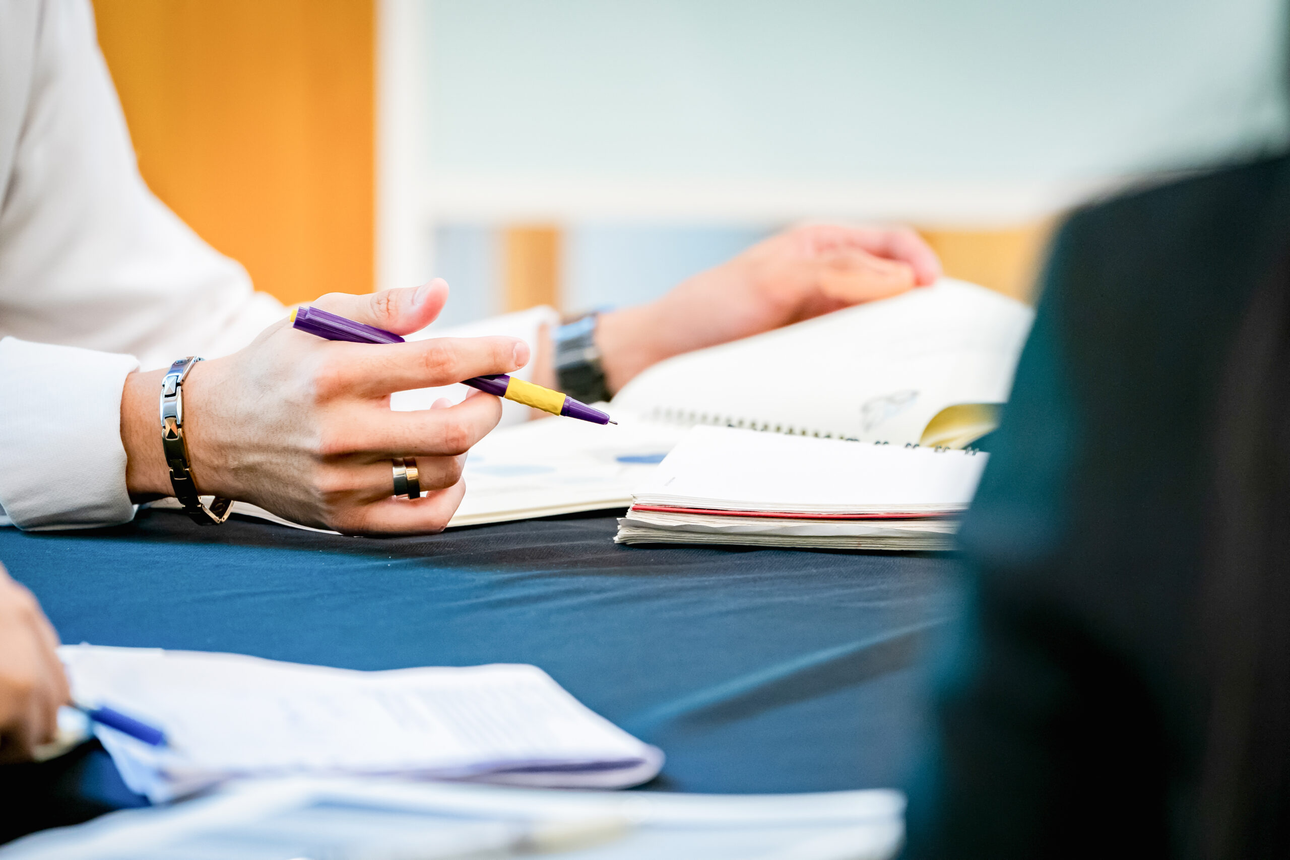 Scientists reviewing real-world and biomarker data to design an adaptive clinical trial
